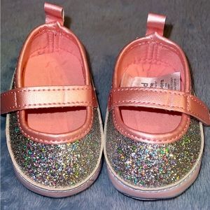 Pink glitter newborn shoes.